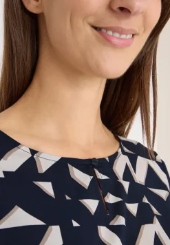 Bedrukte blouse met getapete manchetten