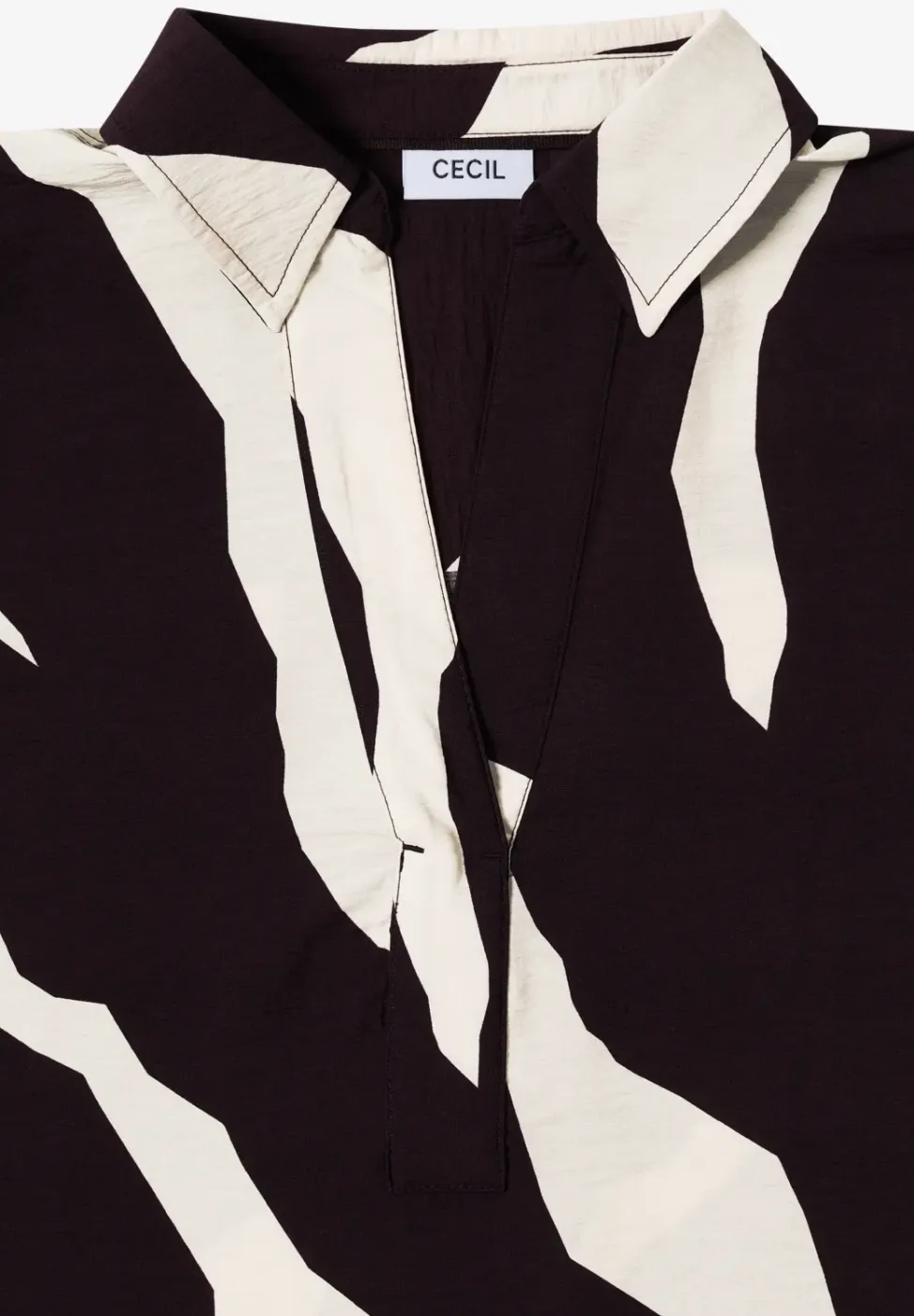 Bedrukte blouse met getapete manchetten