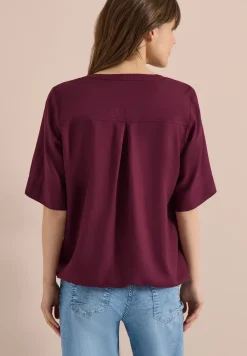 Blouse met gespleten hals en elastische zoom