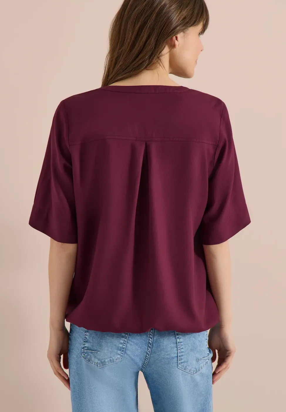 Blouse met gespleten hals en elastische zoom