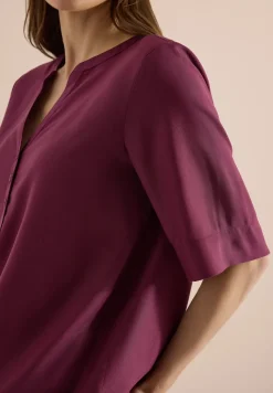 Blouse met gespleten hals en elastische zoom