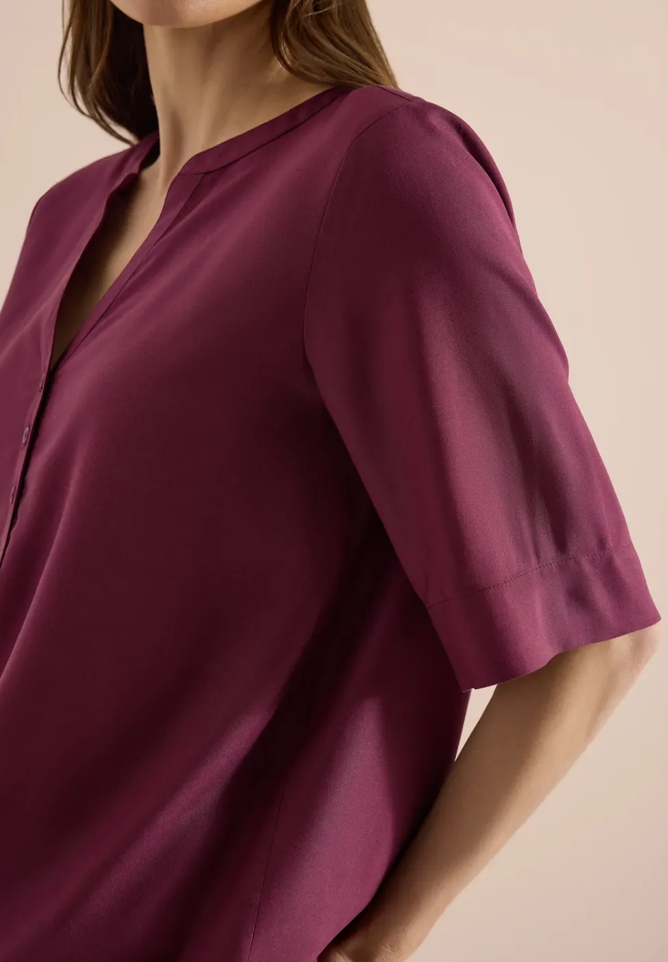 Blouse met gespleten hals en elastische zoom