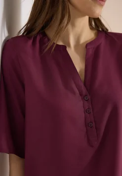 Blouse met gespleten hals en elastische zoom