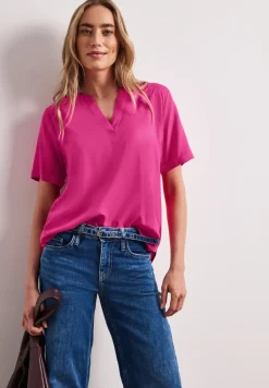 Blouse met korte mouwen en gespleten hals in effen kleur