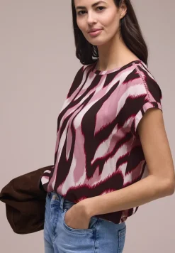 Blouse met overhangende schouders en getapete details