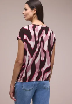 Blouse met overhangende schouders en getapete details