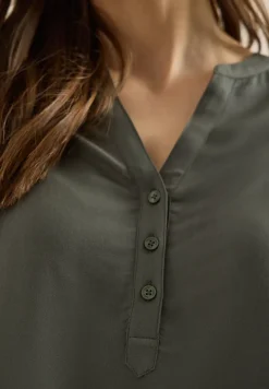 Blouse met gespleten hals en elastische zoom