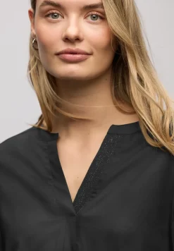 Blouse met glitterdetail