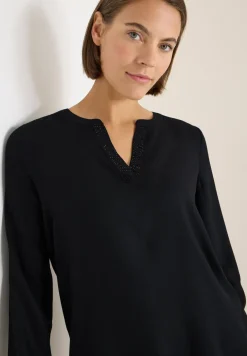 Blouse met glitterdetails