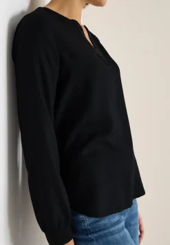 Blouse met glitterdetails