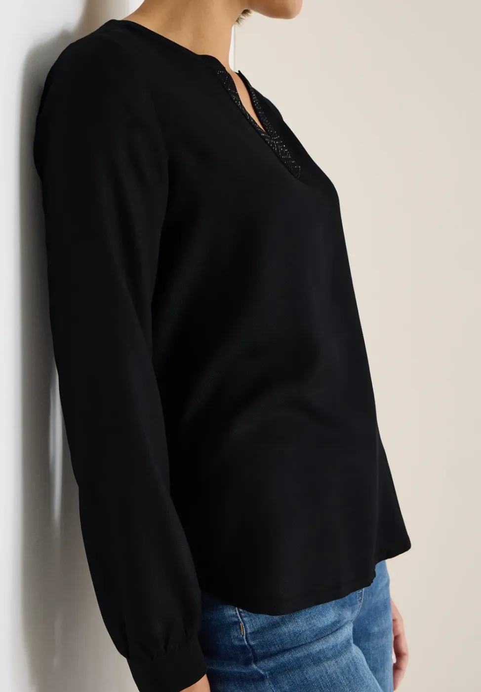 Blouse met glitterdetails