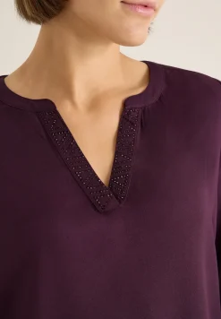 Blouse met glitterdetails