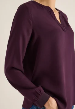 Blouse met glitterdetails