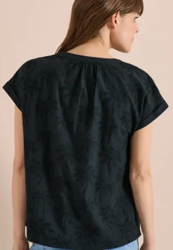 Blouse met hangende schouder en borduursel