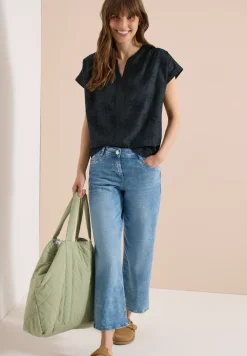 Blouse met hangende schouder en borduursel