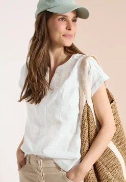 Blouse met hangende schouder en borduursel