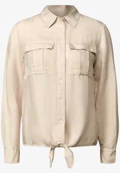 Blouse met knoop in de zoom
