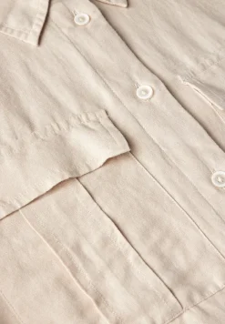 Blouse met knoop in de zoom