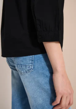 Blouse met 3/4 mouwen en gespleten hals in effen kleur