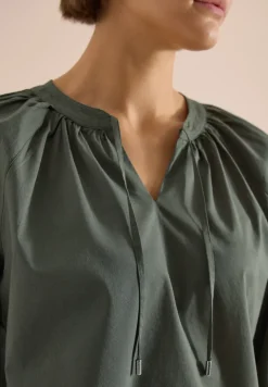 Blouse met 3/4 mouwen en gespleten hals in effen kleur