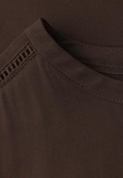 Blouse met overhangende schouders en getapete details