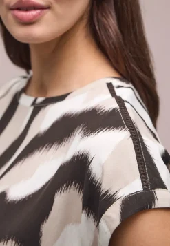 Blouse met overhangende schouders en getapete details