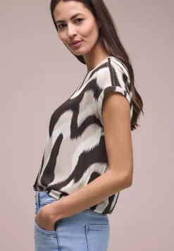 Blouse met overhangende schouders en getapete details