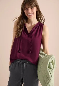 Blousetop met gespleten hals en linten