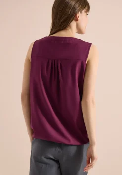 Blousetop met gespleten hals en linten