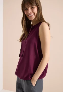 Blousetop met gespleten hals en linten