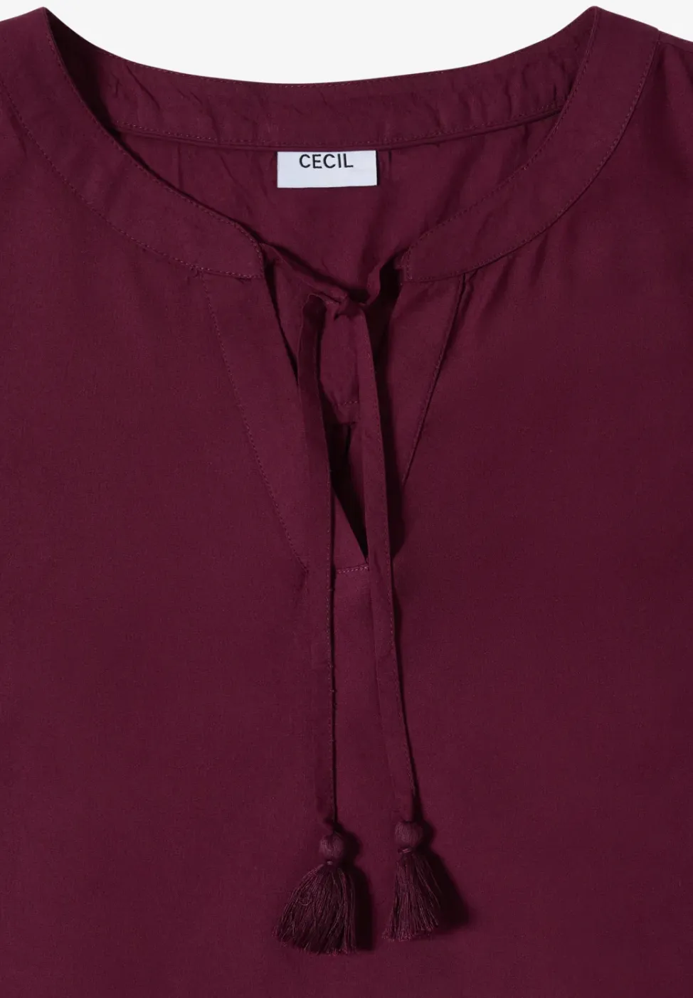 Blousetop met gespleten hals en linten