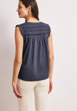 Blousetop met gespleten hals en shiffley-details
