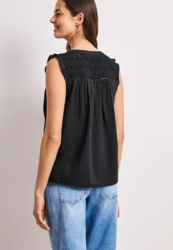 Blousetop met gespleten hals en shiffley-details