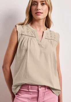 Blousetop met gespleten hals en shiffley-details