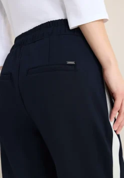 Broek met colour block tape