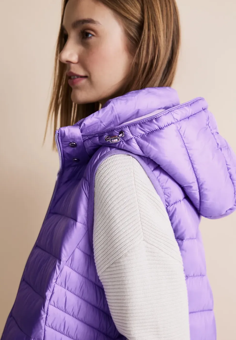 Lange bodywarmer met capuchon