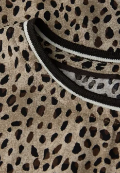 Leo blouse met taping details