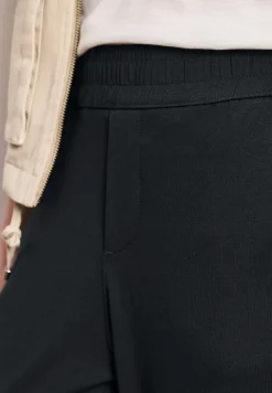 Mid Waist Slim Legs broek in Loose Fit