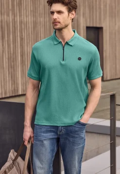 Poloshirt met rits en structuur