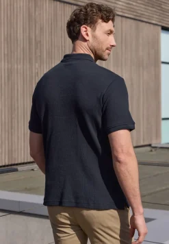 Poloshirt met rits en structuur