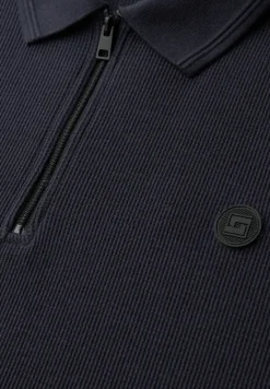 Poloshirt met rits en structuur