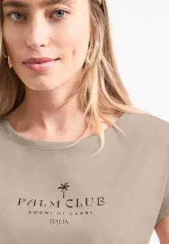 Shirt met hangende schouder en tekst