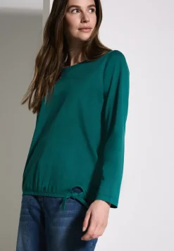 Shirt met knoop in de zoom