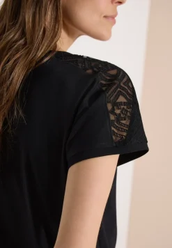 Shirt met overhangende schouders en kanten details