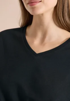 Shirt met overhangende schouders en V-hals