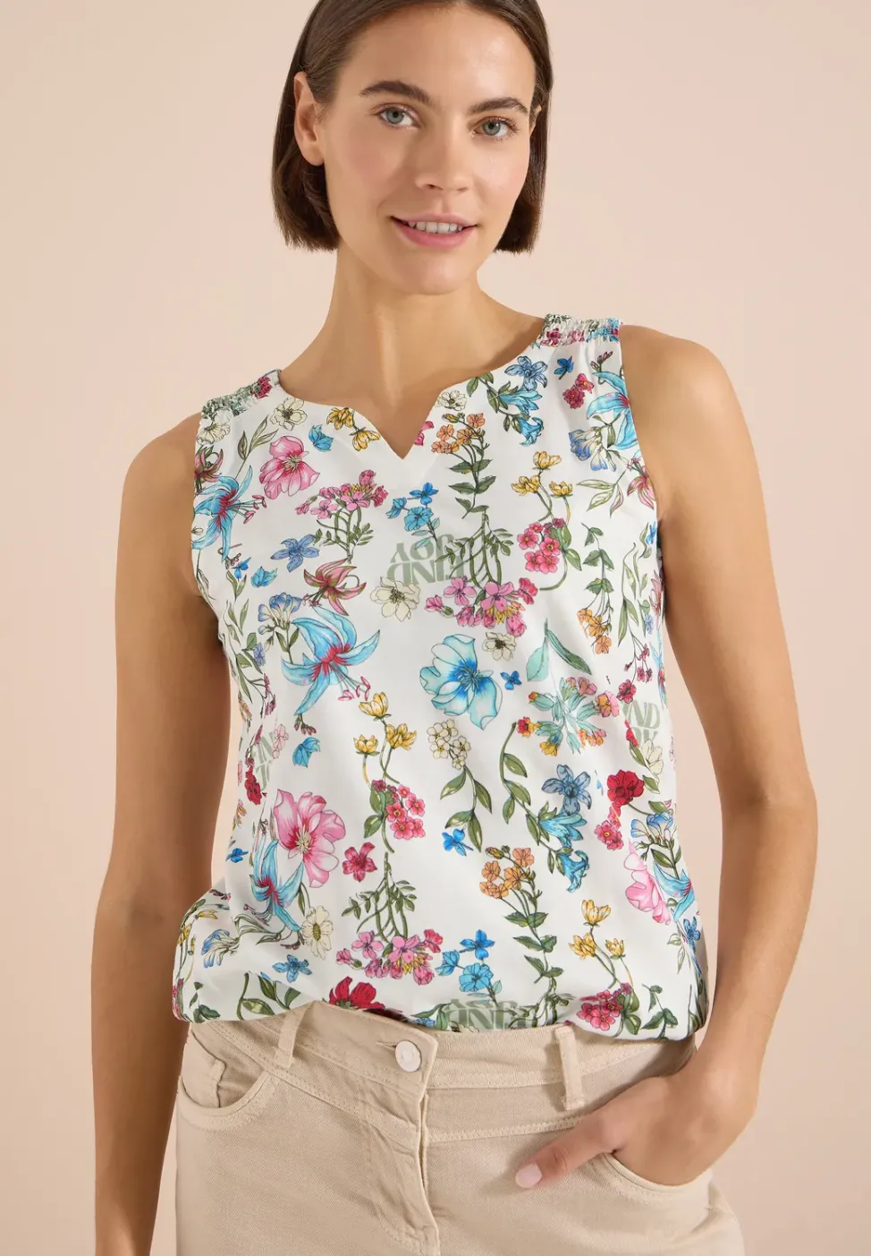 Top met gespleten hals en rimpels
