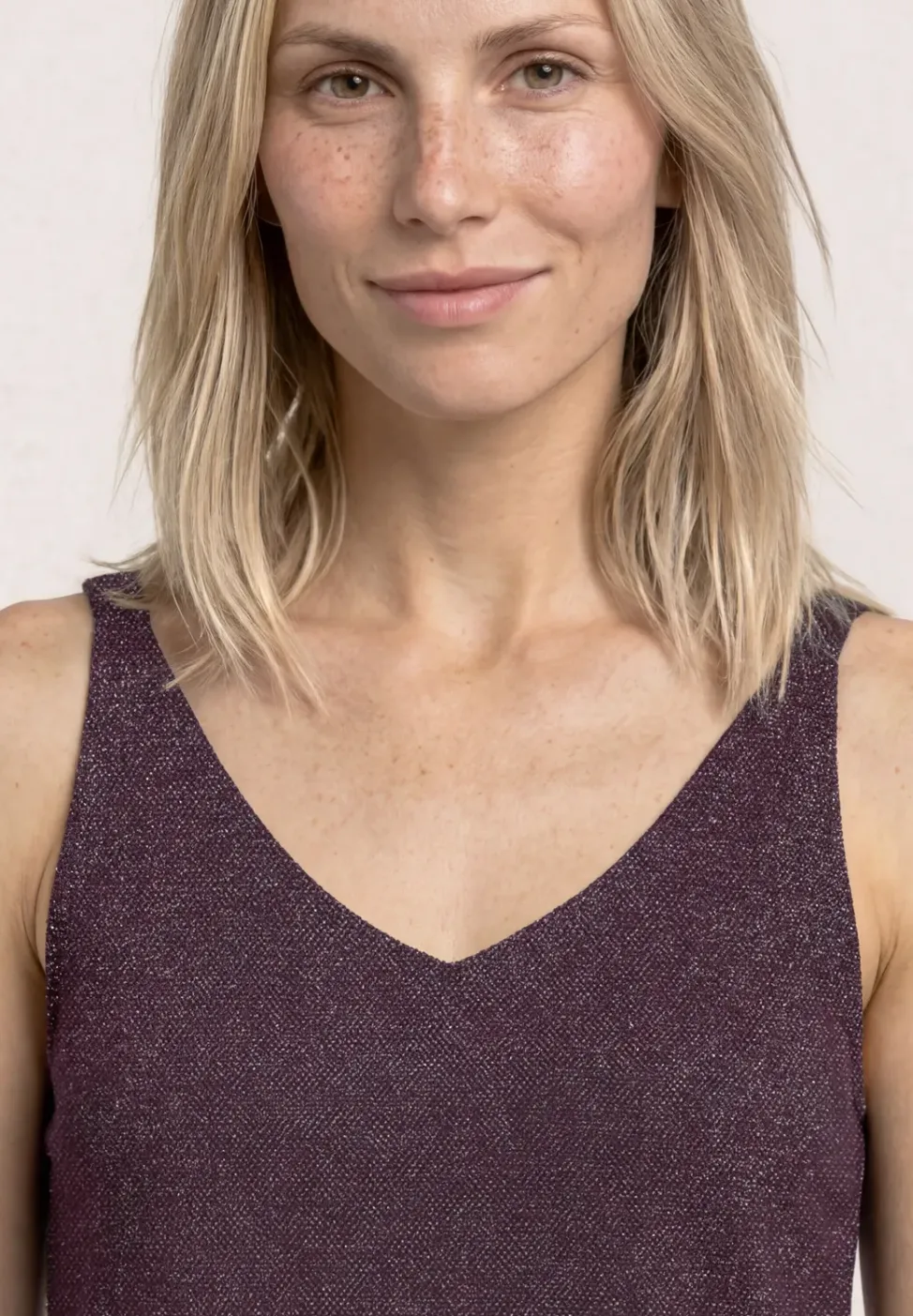 Top met V-hals en glitterdetails