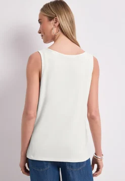 Top met V-hals en knoopdetail
