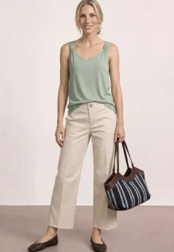 Top met V-hals en knoopdetail