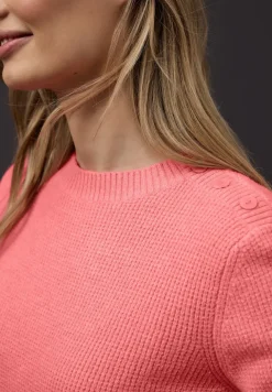Trui met knoopdetail